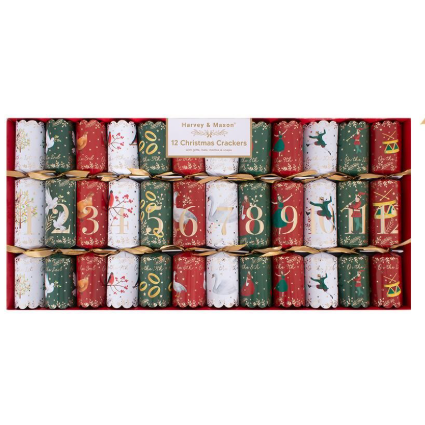 A boxed set of 12 Harrey & Mason Christmas crackers arranged in a red gift tray. The crackers are decorated with festive holiday illustrations and numbers 1 through 12, with a small paper label at the top center reading 'Harrey & Mason 12 Christmas Crackers'.