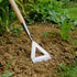 Garden hoe in the ground