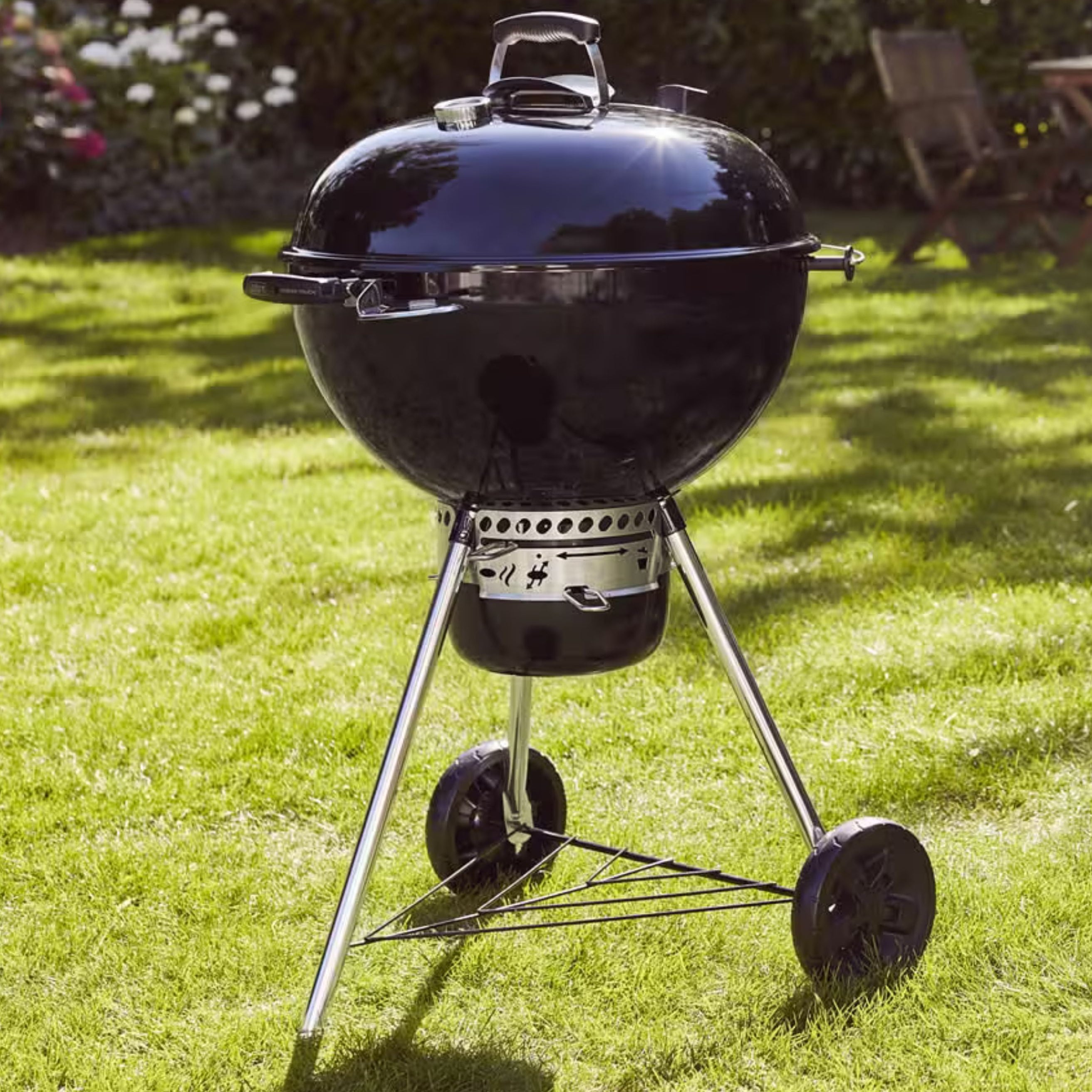 Weber Mastertouch GBS E-5750 BBQ in a garden setting