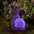 Dog figurine holding a solar light ball