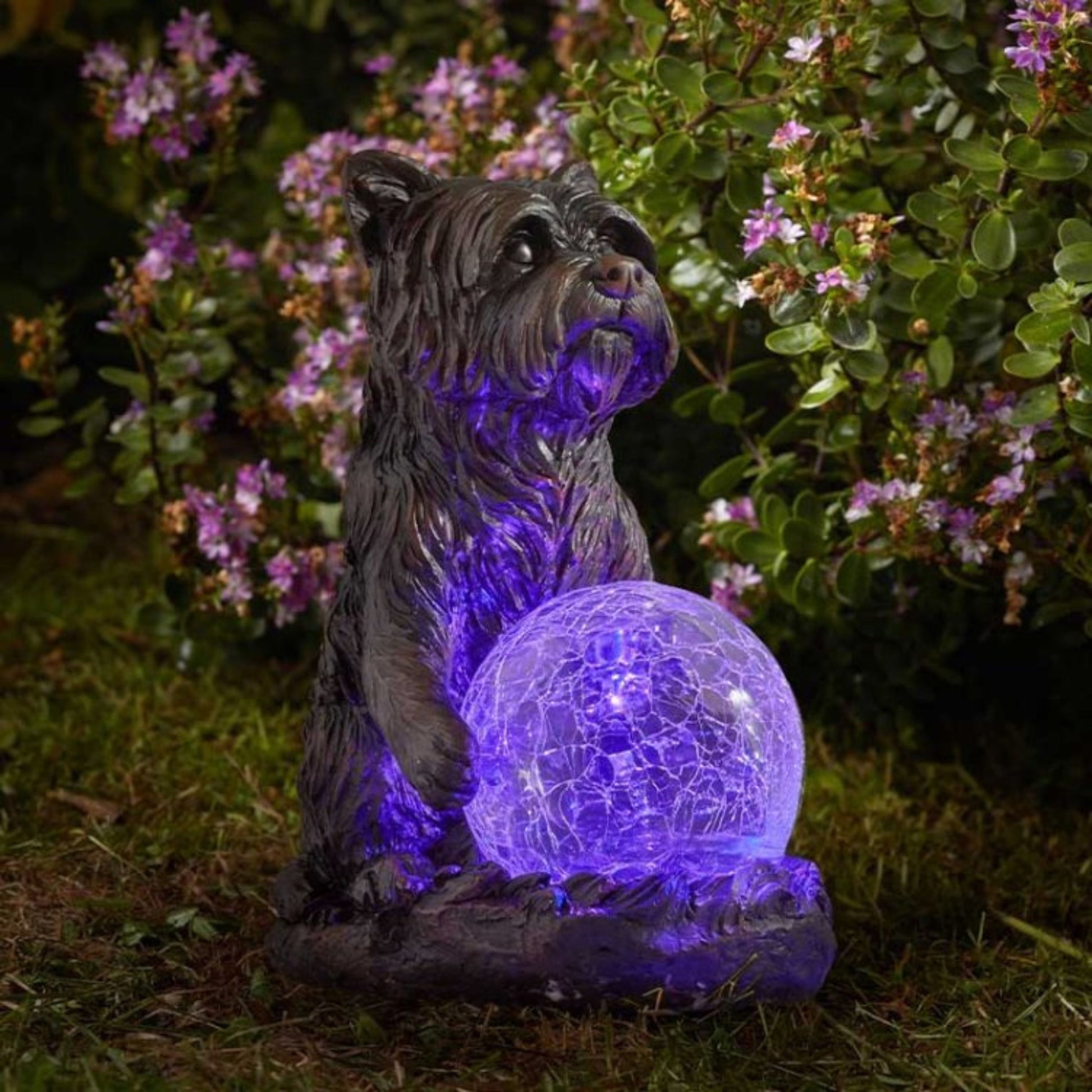 Dog figurine holding a solar light ball