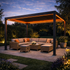 Outdoor patio with pergola, furniture, and decorative elements at dusk.