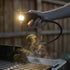 Weber Works Flex Light - Snap On, attached to a BBQ shining it up