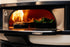 Wood-fired pizza oven with food being cooked inside
